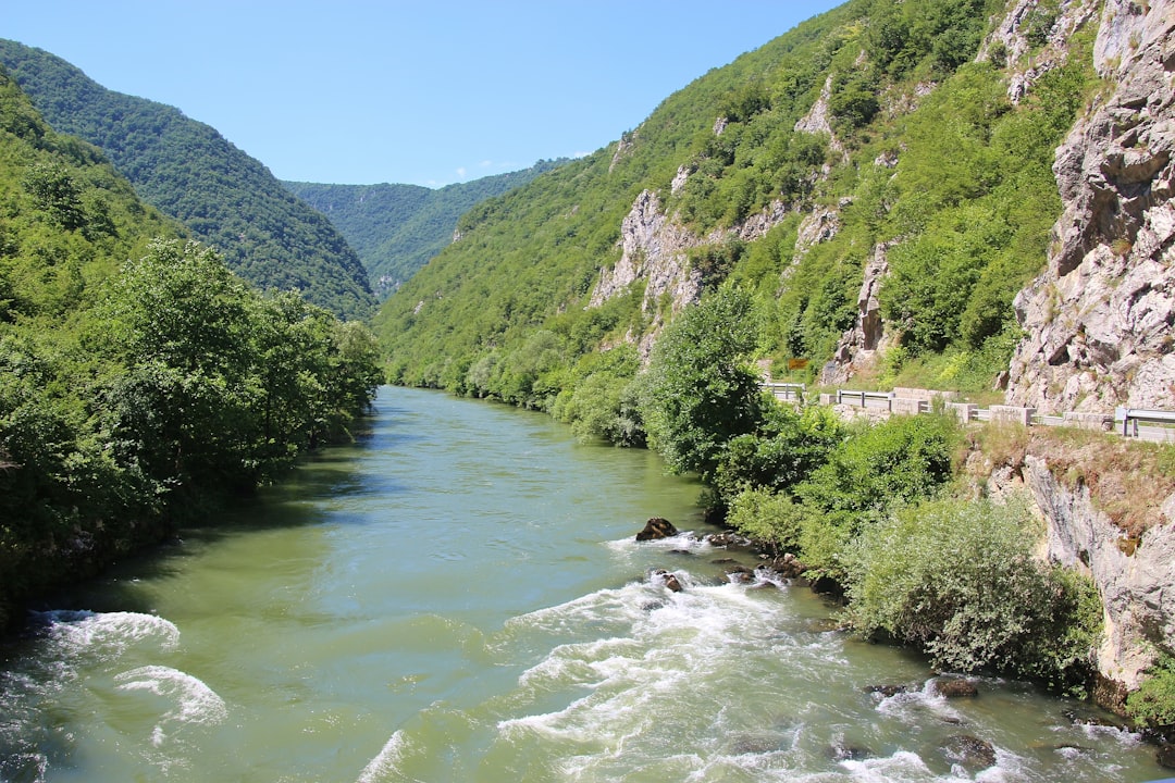 Una River Gorge Trail Bosnia hiker on rocky path overlooking river
