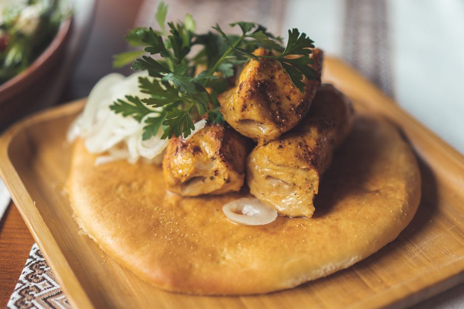 Kotor street food cevapi plate flatbread onions outdoor table