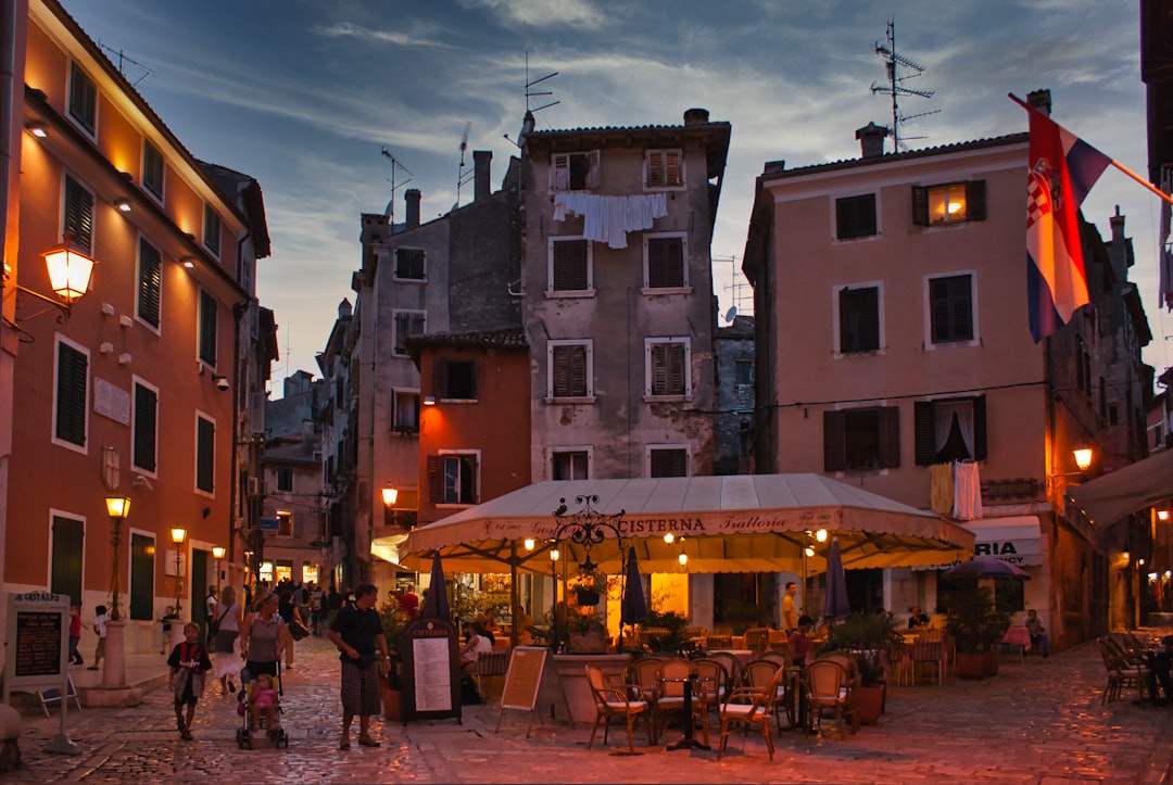 Rovinj nightlife street scene bars outdoor seating evening