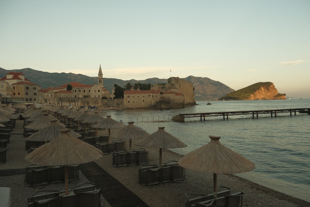 Savina Kuk Montenegro secluded pebble beach nudist calm water late afternoon