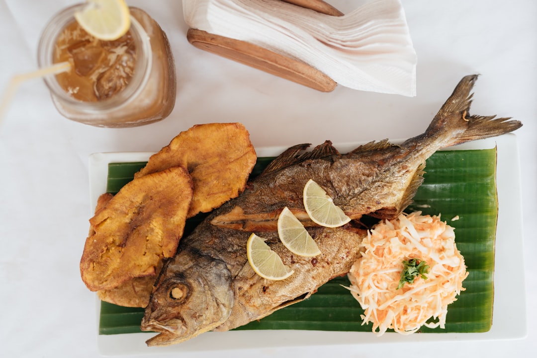 Fried crappie fish Danube Delta Romanian restaurant grilled onions