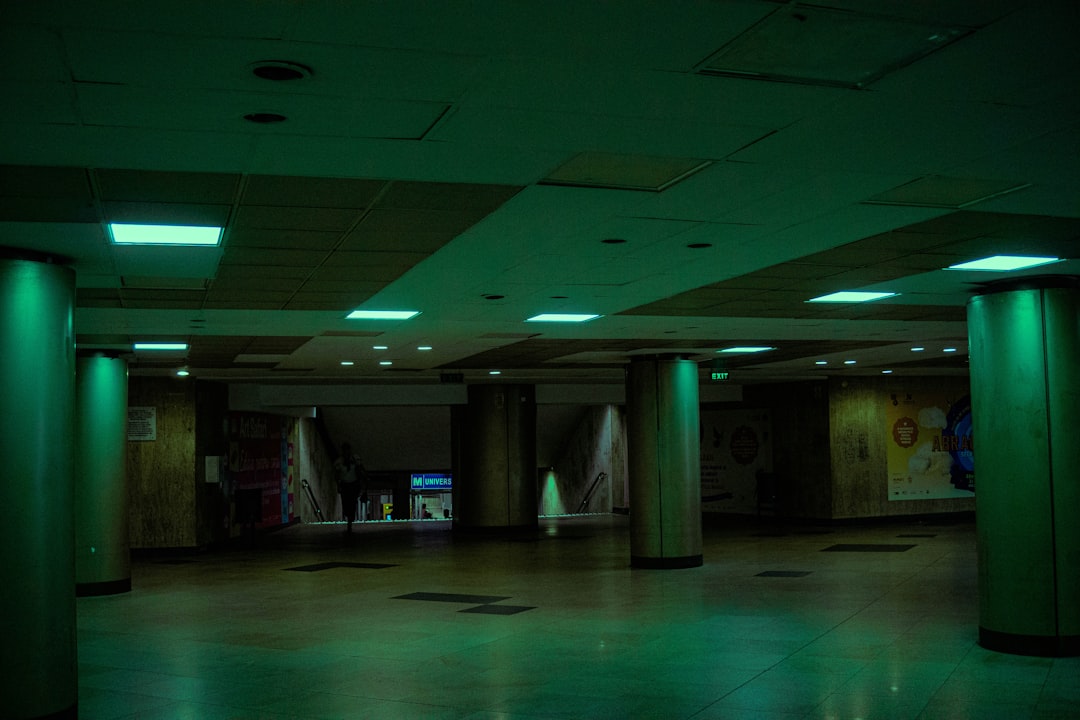 Bucharest club interior neon lights dancing crowd