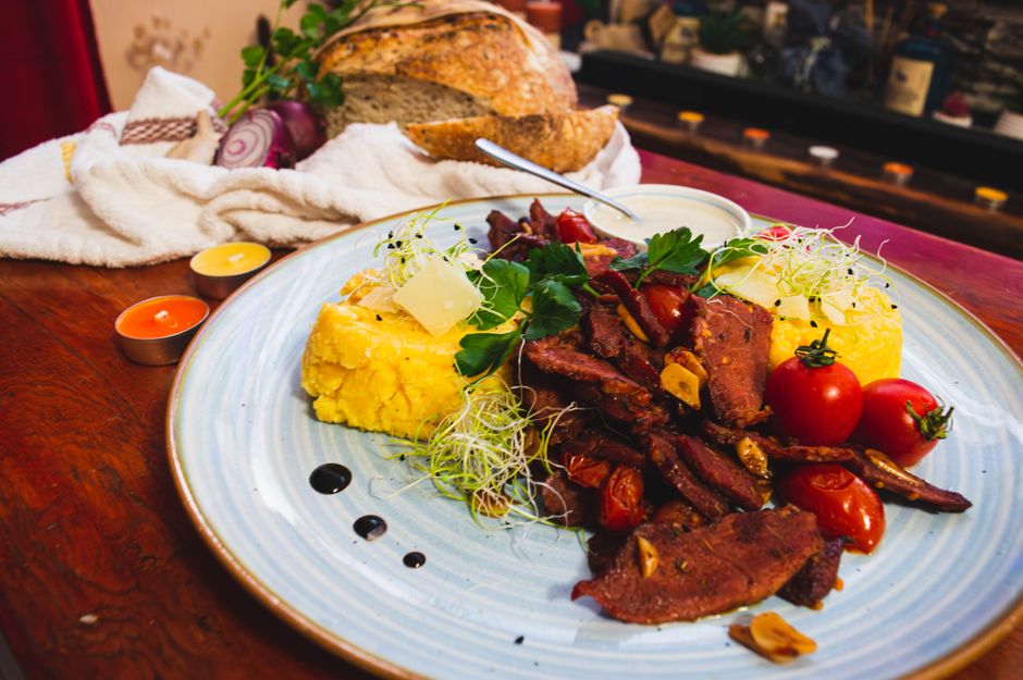Romanian mici grilled sausages polenta plate
