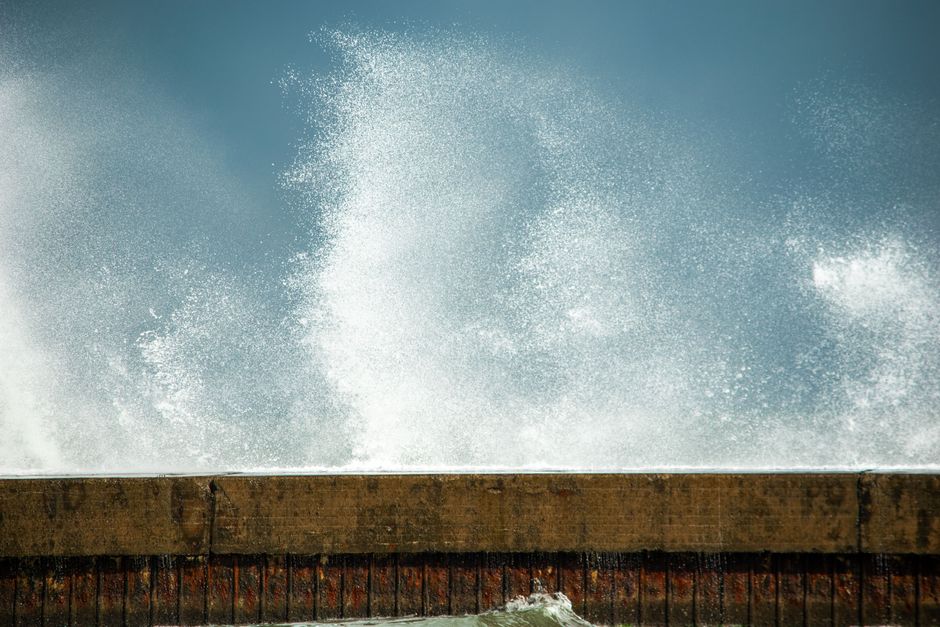 Golden Sands sea wall storm waves crashing concrete promenade Bulgaria