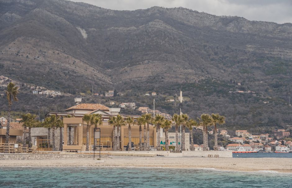 Skalina Beach Kotor Montenegro pebbles fortress view blue flag