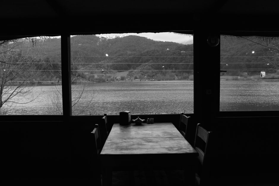 Planika Lodge Slovenia interior dining hall rustic wooden tables mountain view