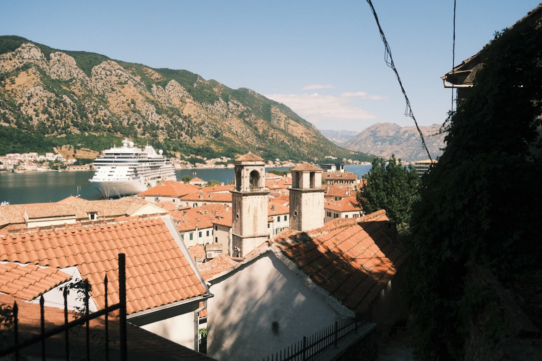 Kotor old town restaurant terrace stone steps mountain view