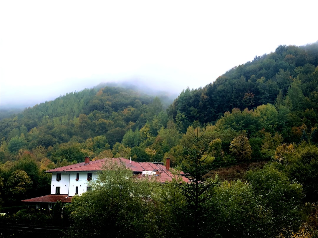 Sapareva Banya thermal baths Bulgaria steam rising mountain backdrop