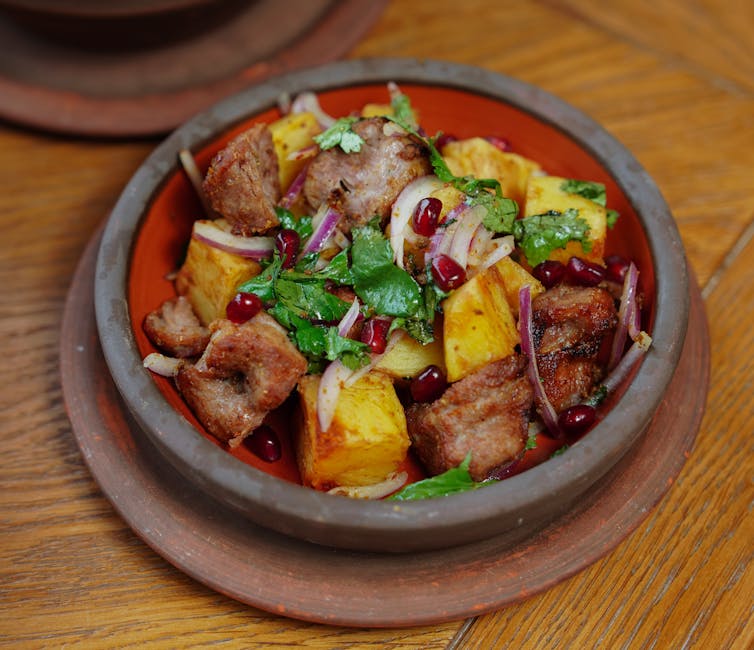 Banka dish Bulgaria clay pot lamb potatoes rustic table