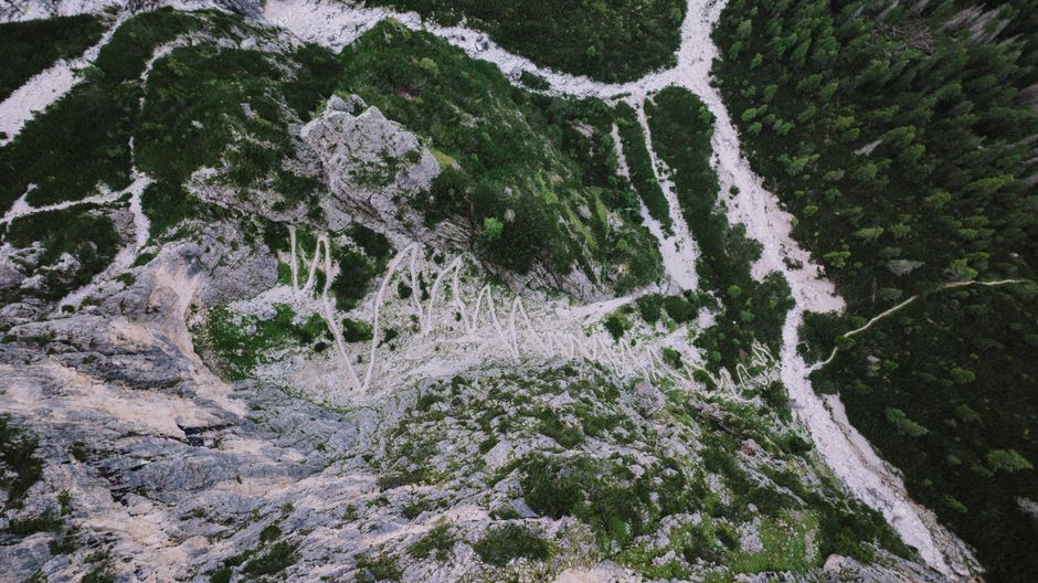 Vrata Valley trail Slovenia marked path alpine meadow rocky terrain hiker