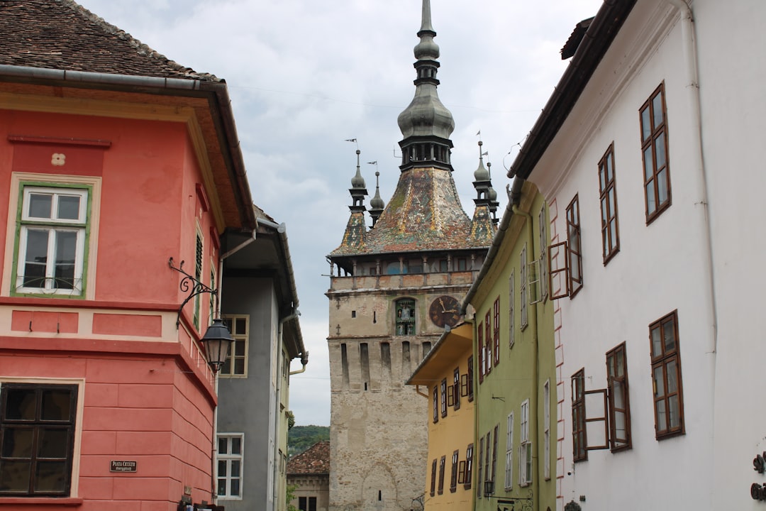 Sighișoara Citadel Romania Clock Tower colorful houses narrow street