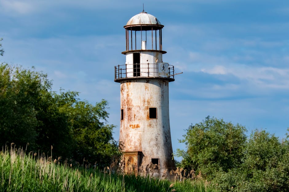 Sulina Lighthouse Romania red white striped tower Black Sea sunset