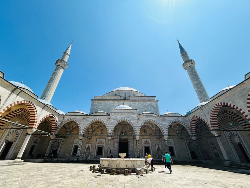 Imperial Mosque Prizren courtyard fountain stone arches morning light